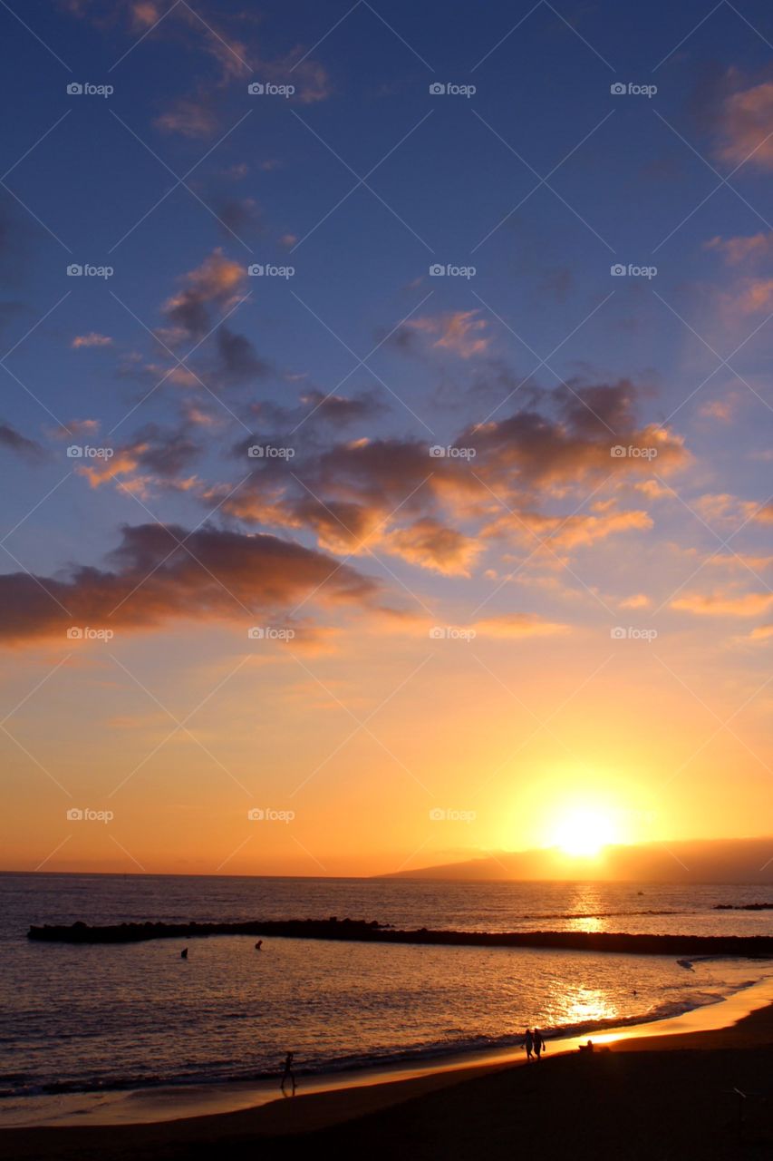 Sunset off the coast in Adeje, Tenerife, Canary Islands.