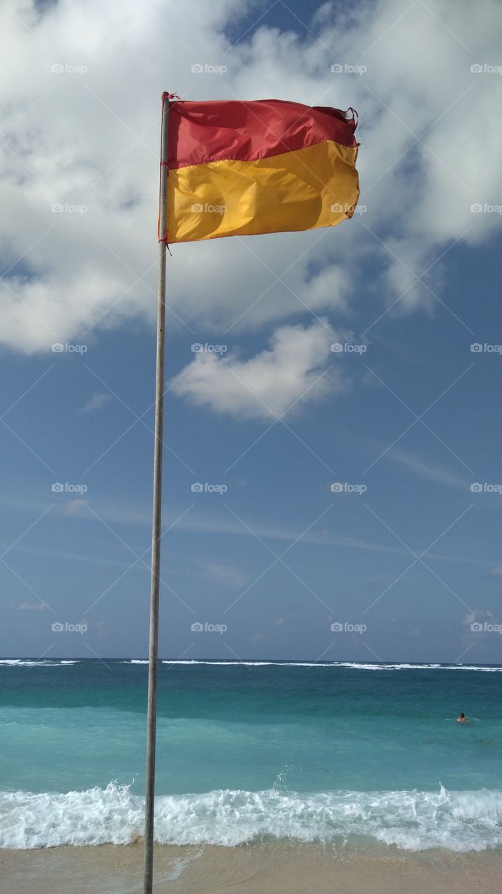 Beautiful beach and a flag.