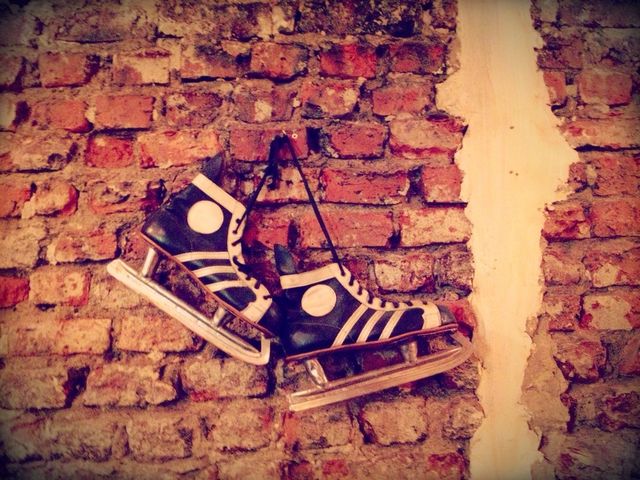 ice skates on the brick wall