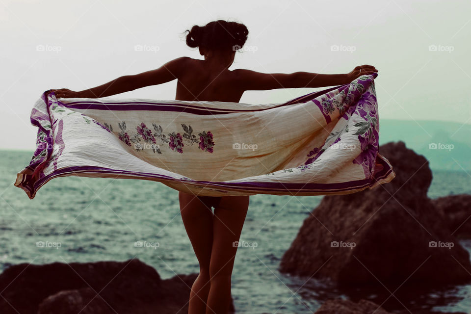 Girl with palatine enjoy summer at sea 