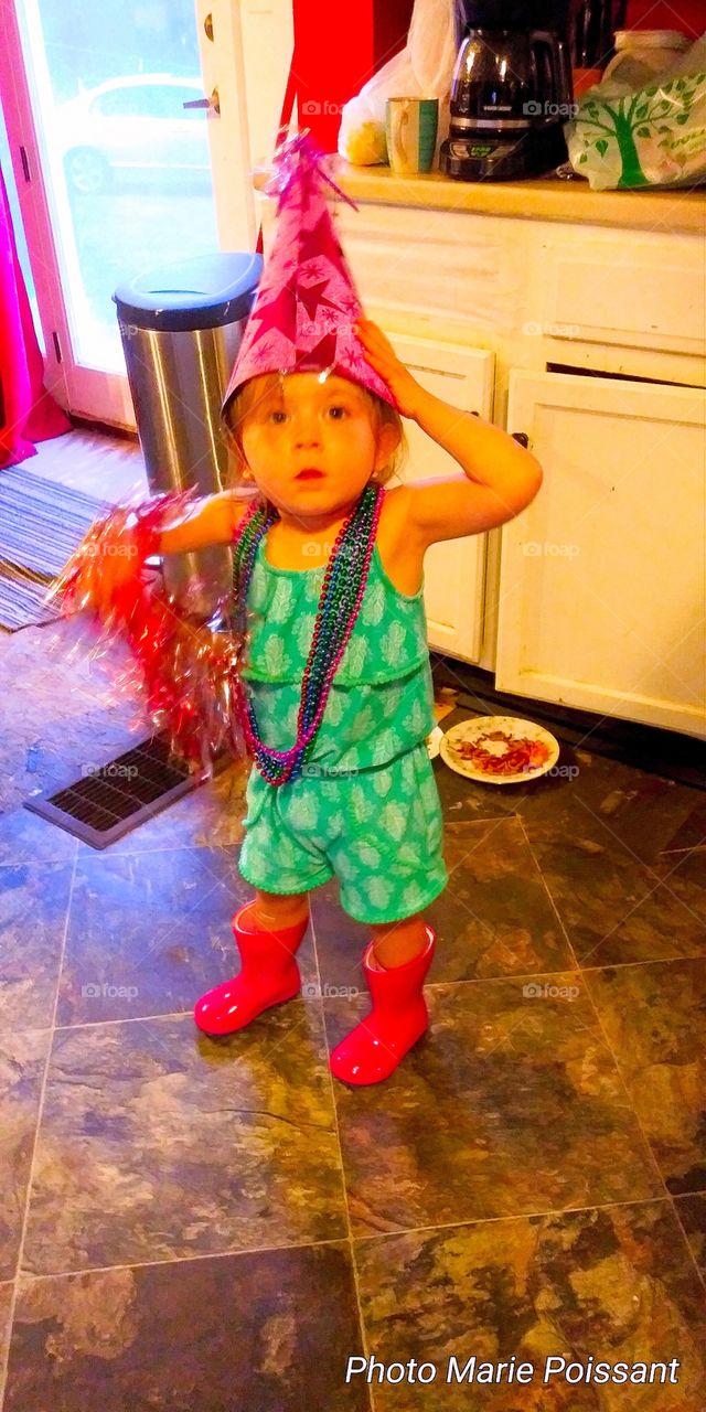 little girl in red boots