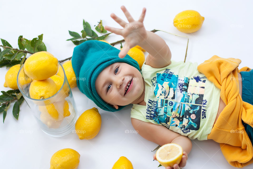 boy and lemons in the frame