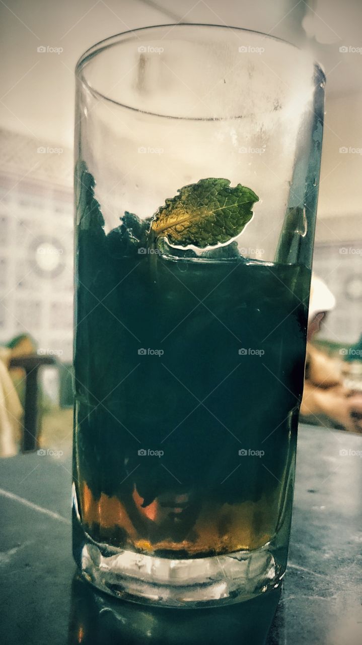 a cup of tea with mint inside..