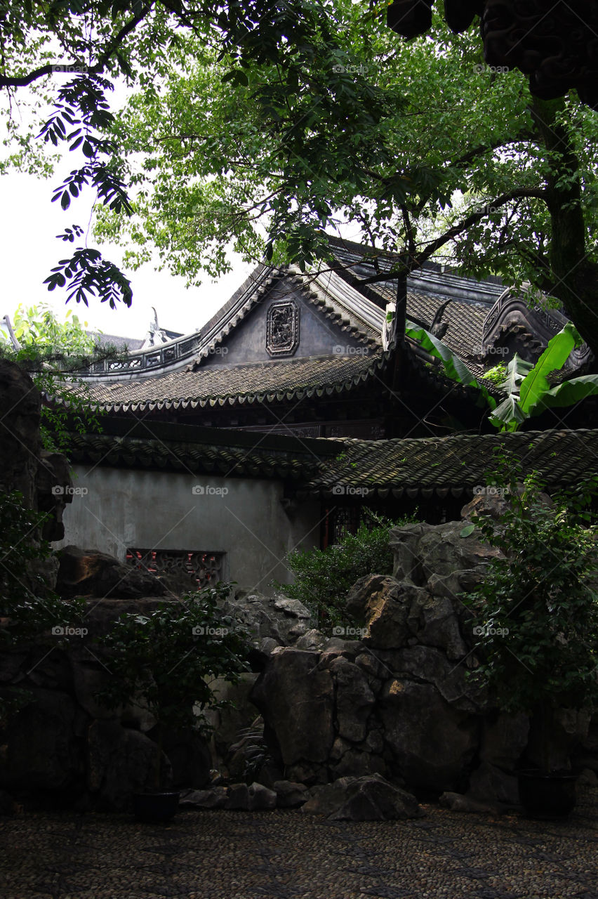 building between rocks. A traditional building in yuyuan grden, shanghai, China.