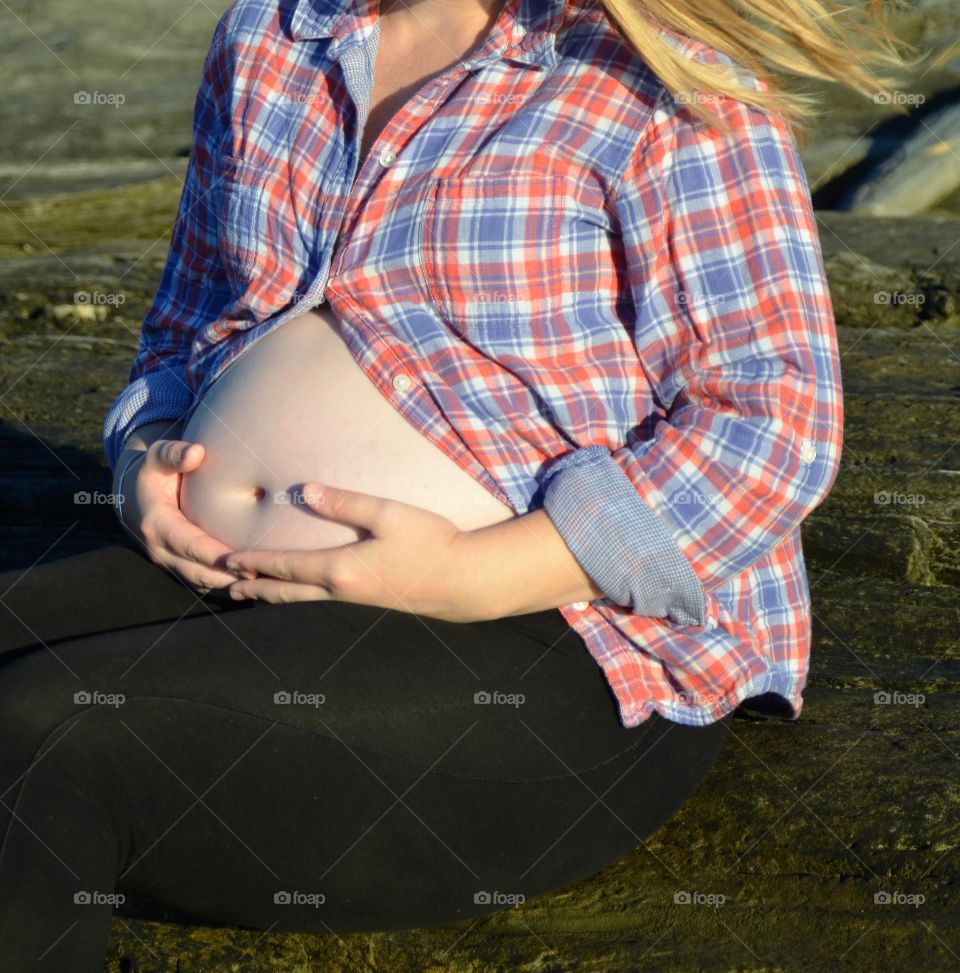 Pregnant woman on beach 