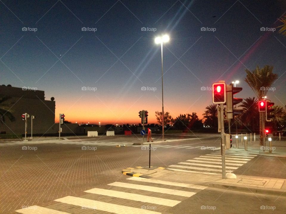 Crosswalk Twilight . Sunset over a street in Muscat, Oman. 