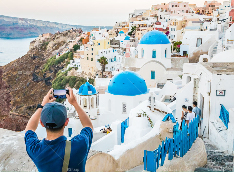 Tourist Taking Photo With Smartphone In Famous Greek Island Santorini