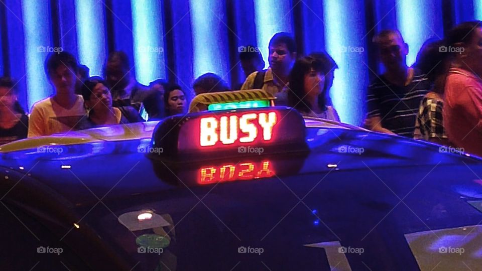 BUSY..  wait for the next cab. people anxiously waiting in a cab queue