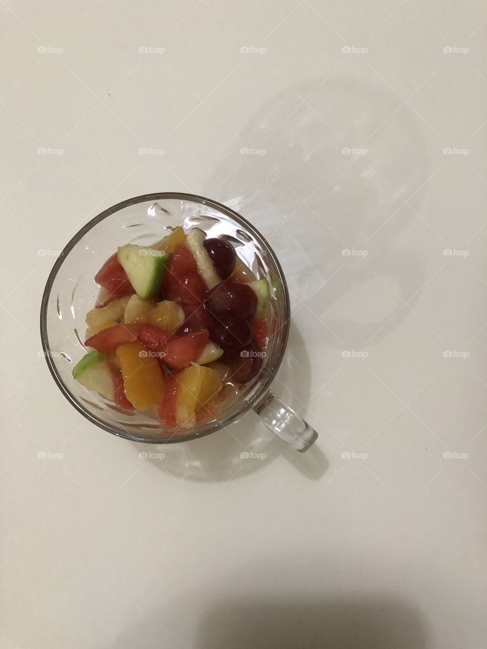 Fruit salad in glass cup 
