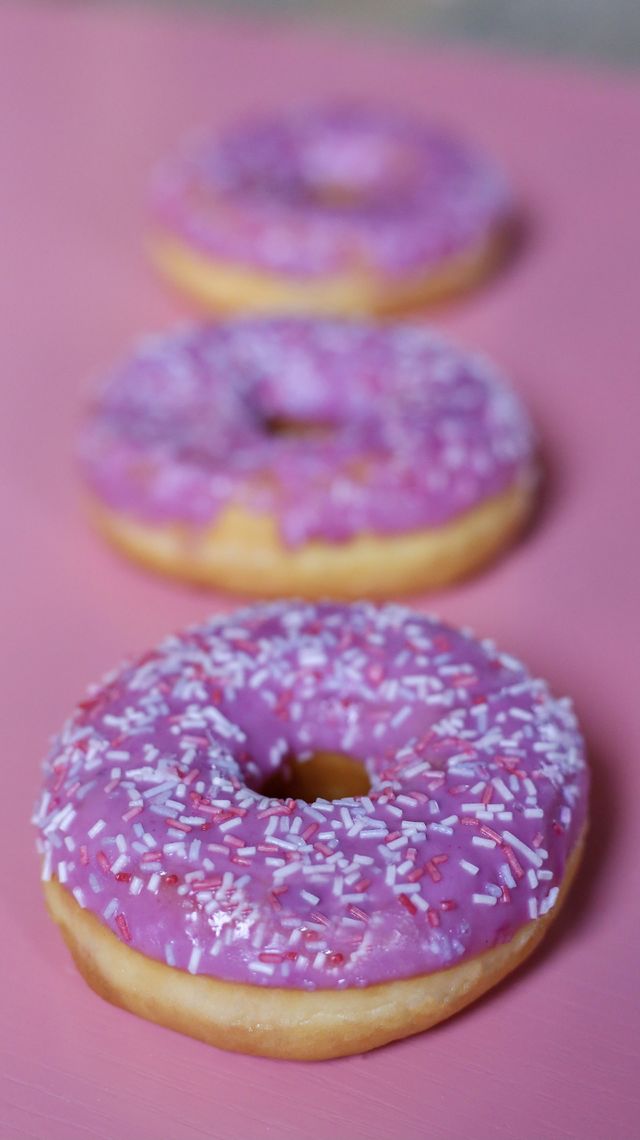 bright pink donut on pink background