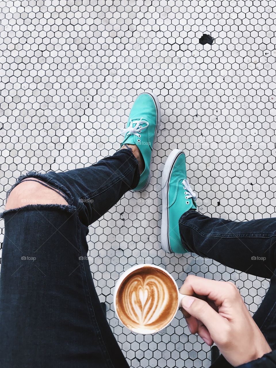 Coffee and feet on a cool tiled floor. 