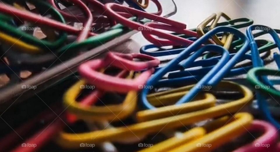 Paper clips falling from a box