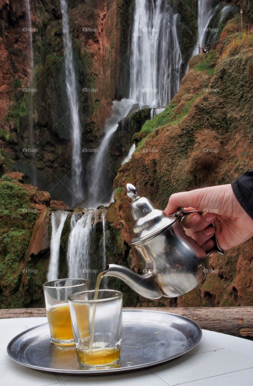 Close-up of a person pouring tea