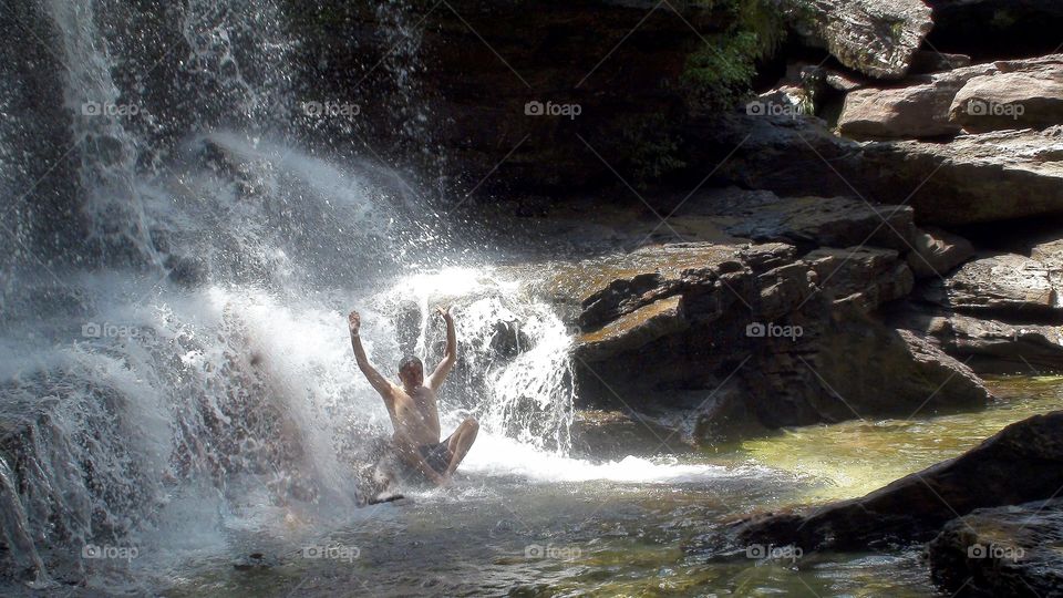 Man enjoying waterfall