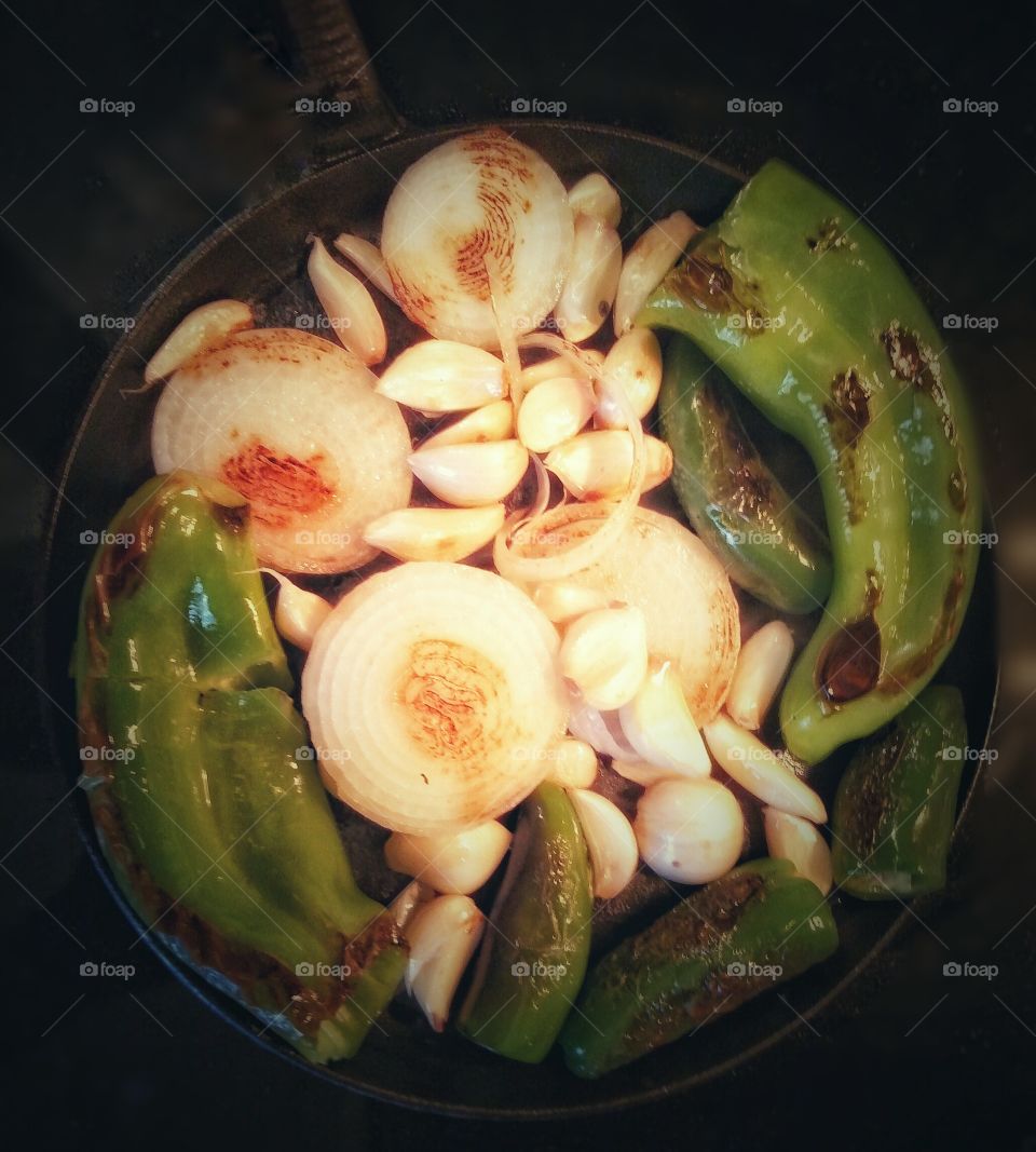 Cooking up peppers, onions, and garlic for carne asada tacos