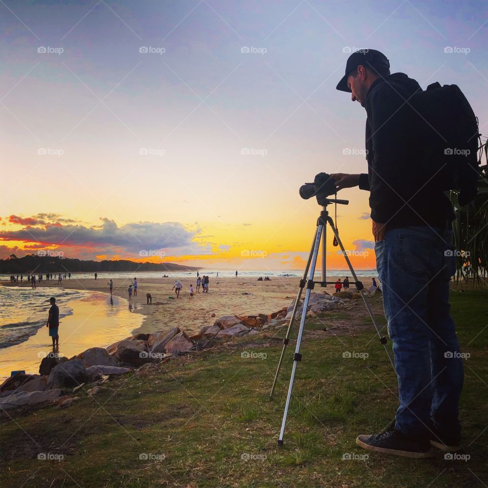 The photographer at the spit at sunset 