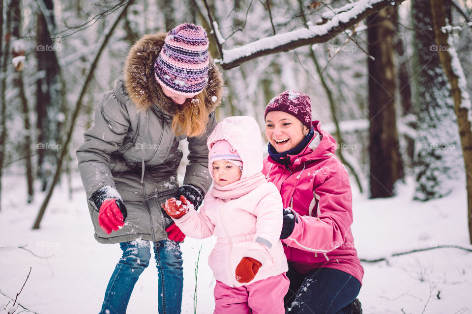 Winter with friends. Spending wintertime outdoors playing with snow