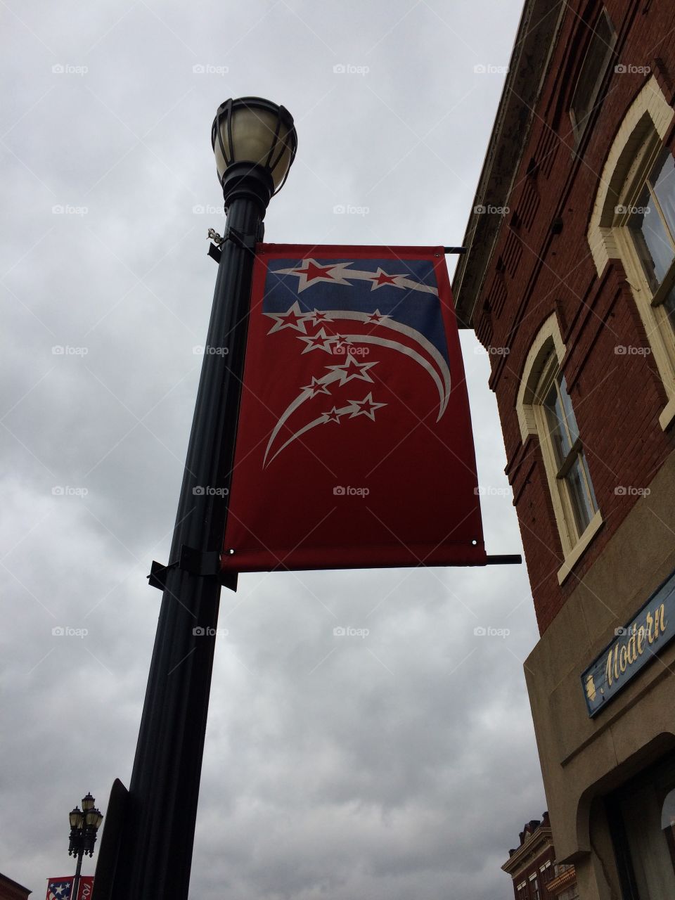 Flag on a light pole in the middle of town