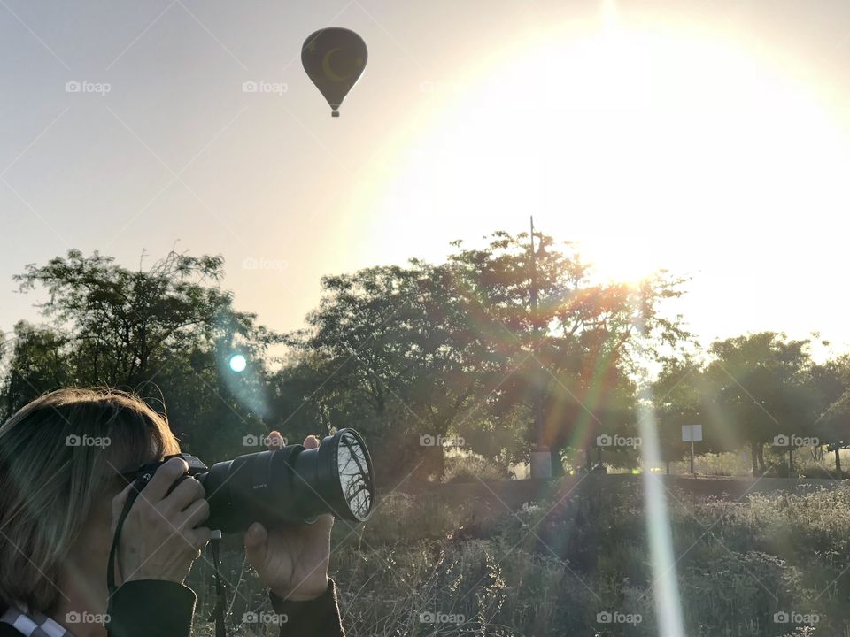 Photographer at sunrise 