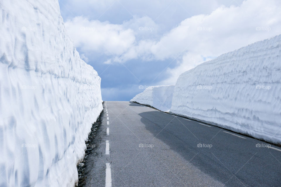 road with high snow drifts in Norway