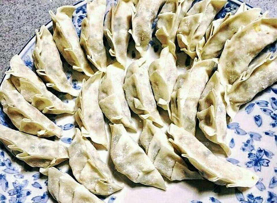 GYOUZA OR DUMPLINGS
A japanese pan fried dumplings.It's ground pork and cabbage combine together and wrapped  in crispy chewy wrapper.Deep fry and serve with soy sauce and vinegar with a bit of chili oil.Also famous in Korean and Philippine version of cooking.