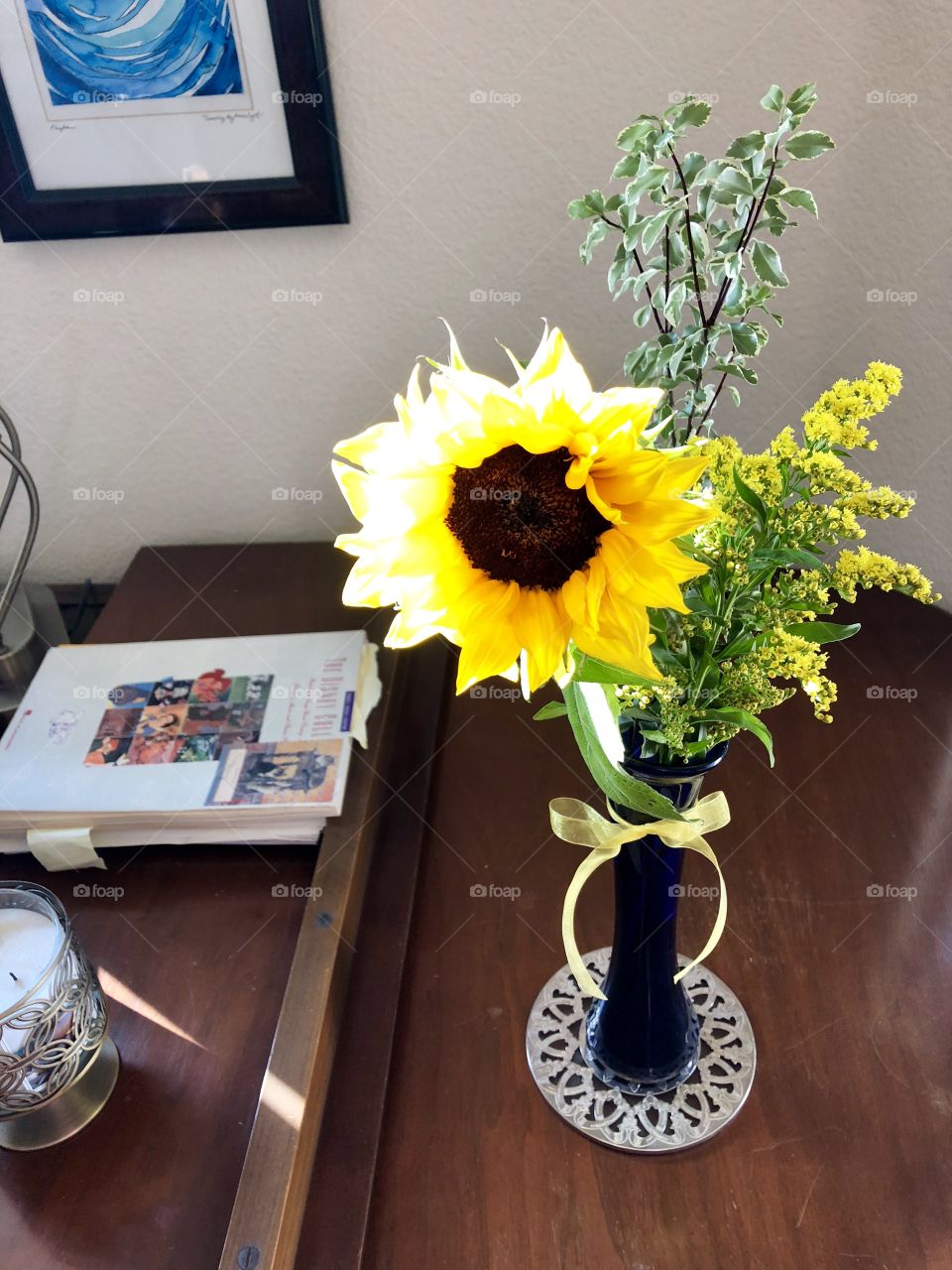 Sunflower bouquet on piano.