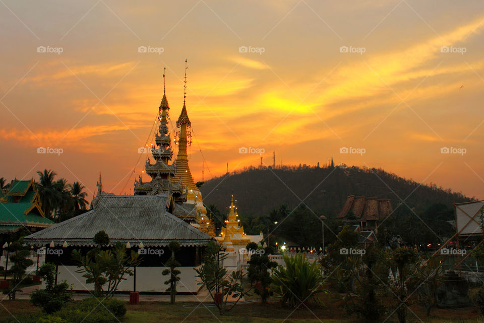 The temples in Thailand are beautiful, the art is delicate, unique to the beautiful evening atmosphere while the sun goes down.
