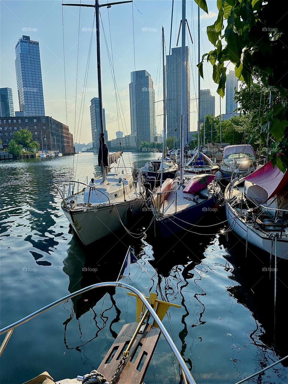 This is “Newtown Creek” by the ”Pulaski Bridge” in LIC, Queens with its great variety of boats at sunset seen from aboard “Salvation”, the “28 ft 1969 Luhrs” cabin cruiser, home to myself and partner “Timothy Trespas”. 2024. Hypnotic Productions