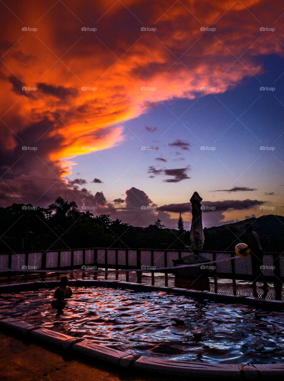 Sunset. Sunset while swimming in the pool