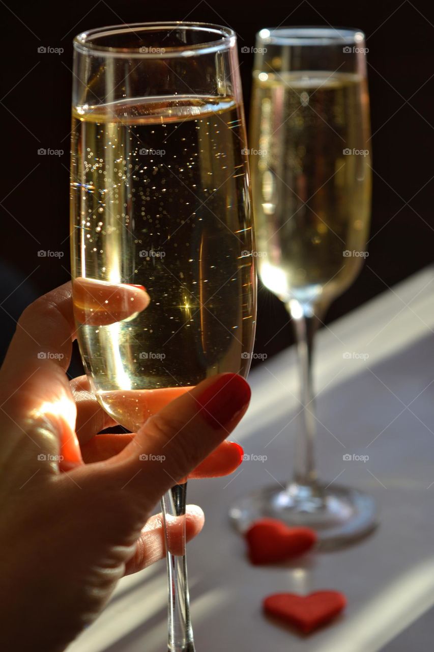 champagne glasses in the hand