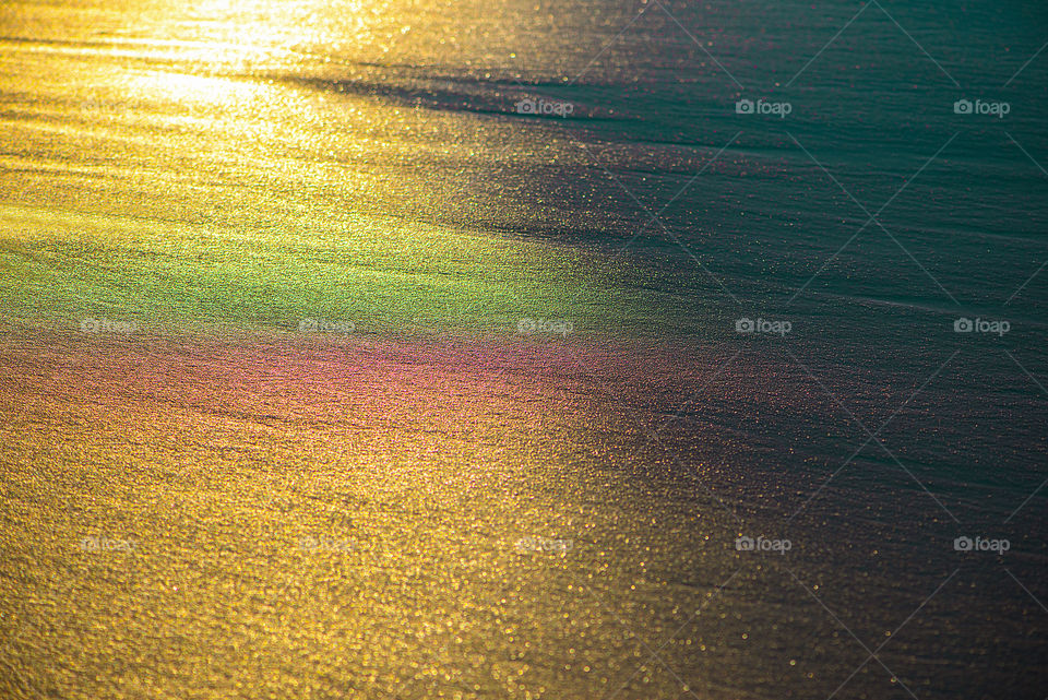 Evening sunlight on beach sand