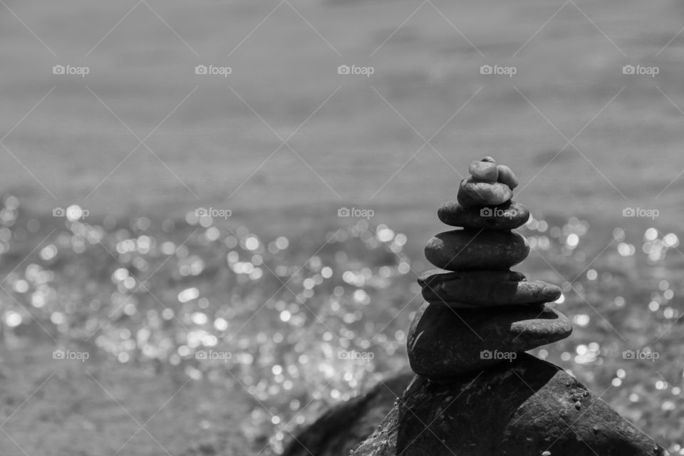 Tower of stones on the sea shore. Concept of balance.