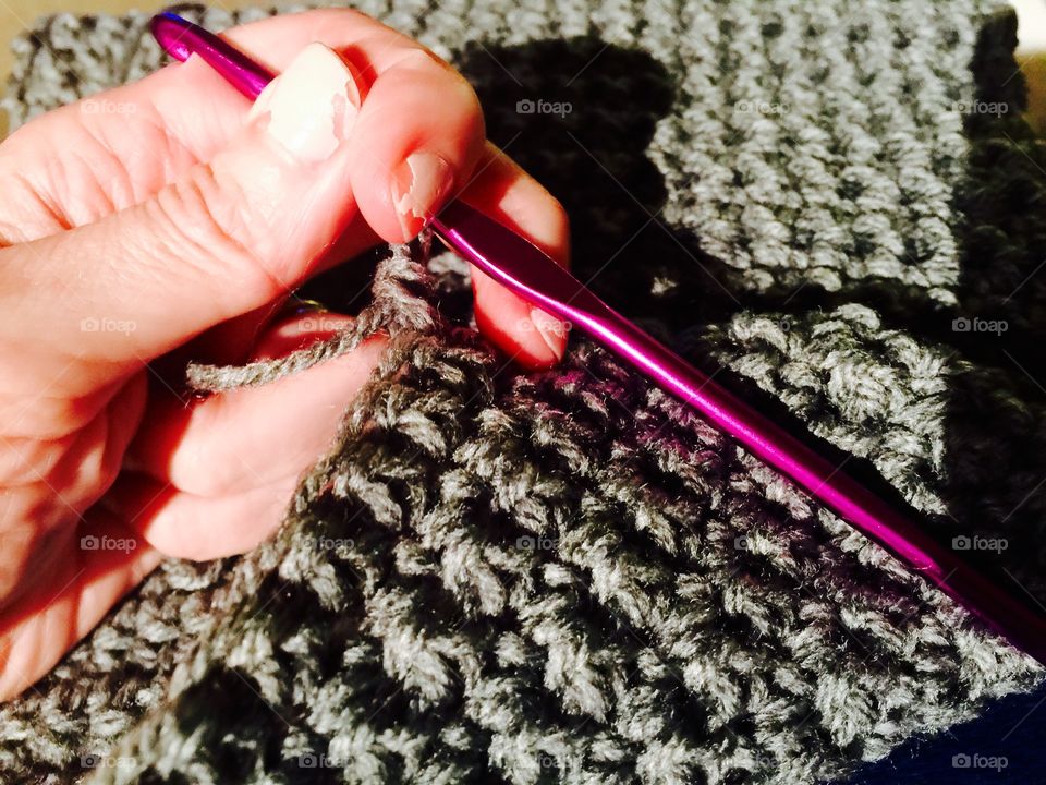 Close-up of human hand crocheting