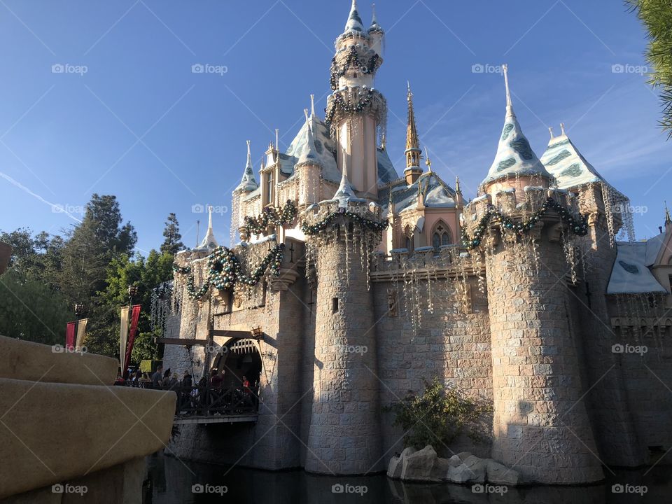 The castle, in Disneyland California! It stands bold against the mildly dark sky, imposing its might upon the park.