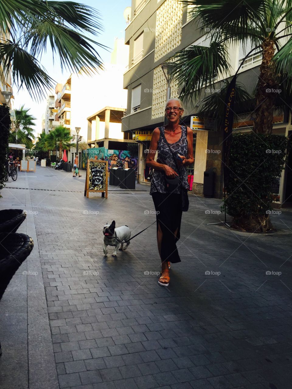 Mom walking our frenchie. This is the french bulldog presley & her mommy out for a walk in sunny torrevieja, Spain
