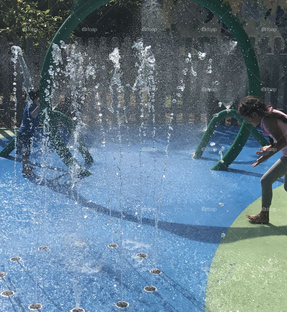 Children playing in fountain