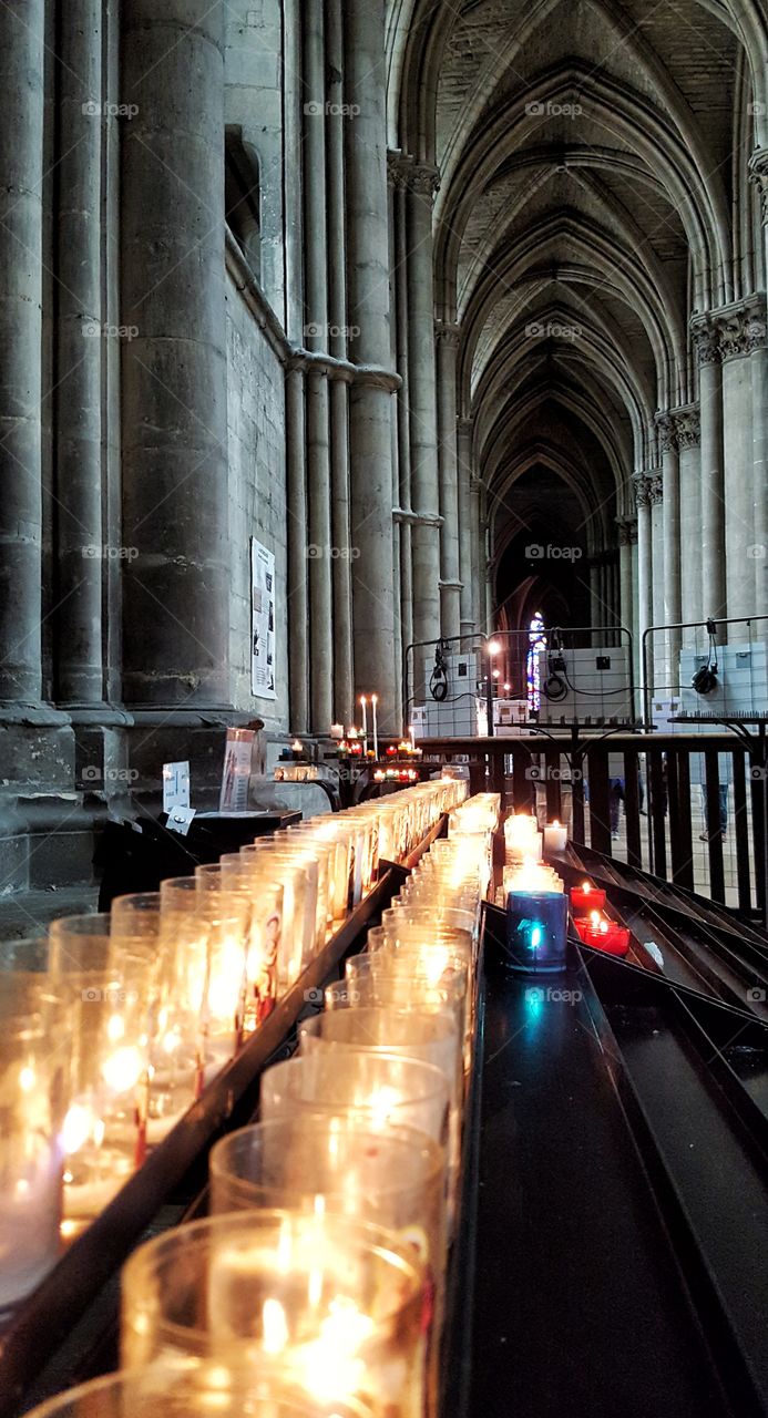 Burning candles in Reins Cathedral France