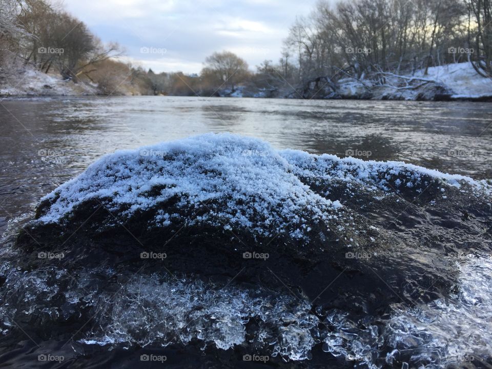 My son’s photo of a rock covered in ice .. 