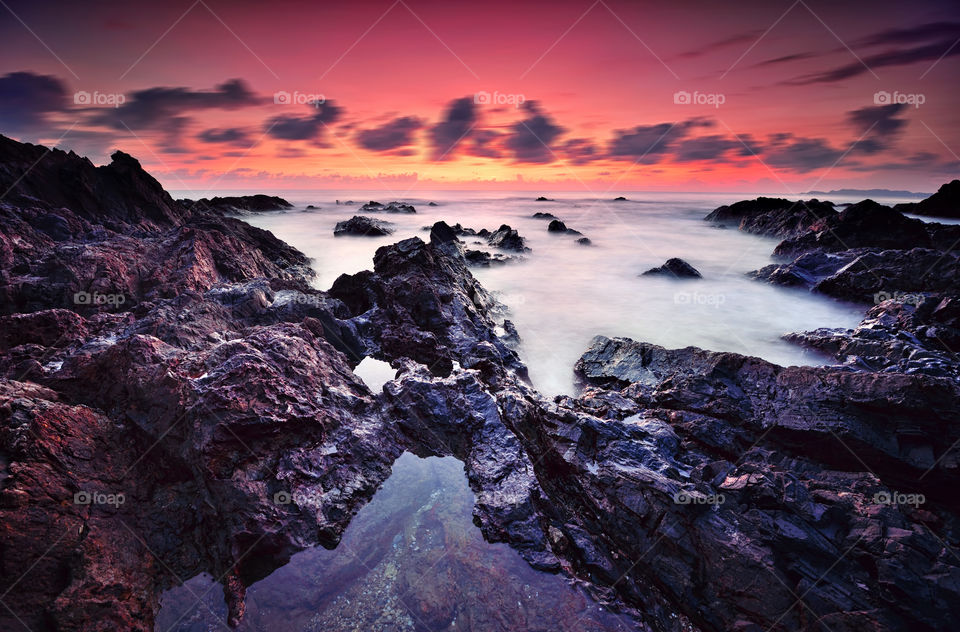 Rocky beach at sunset