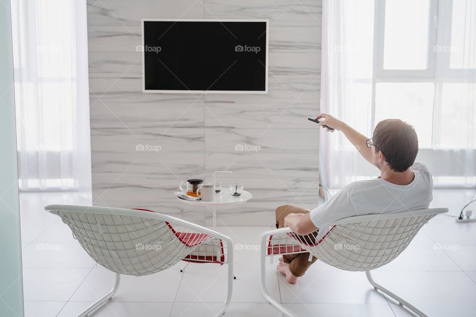 man watching TV