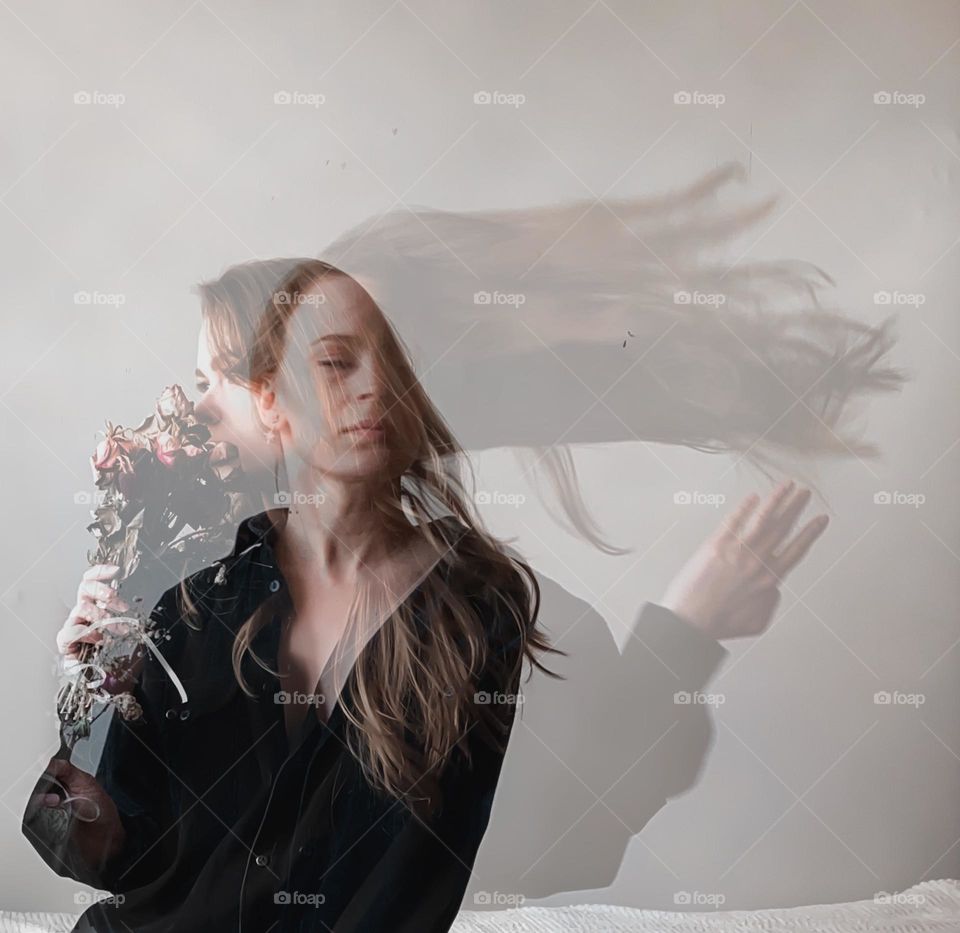 Double exposure photo of a girl with flowers