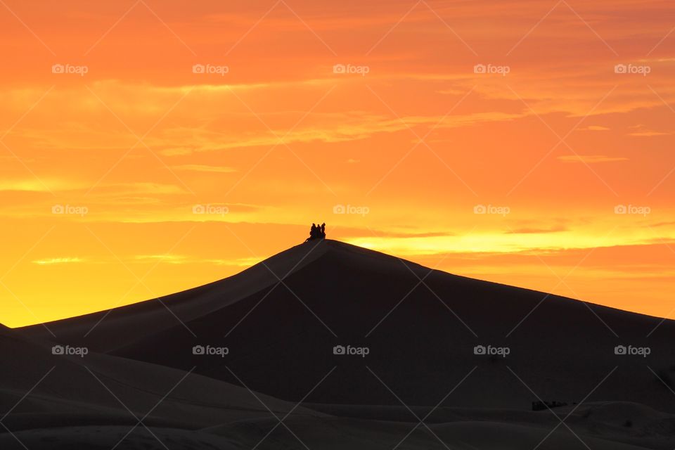 Sunrise in Sahara sand dunes 