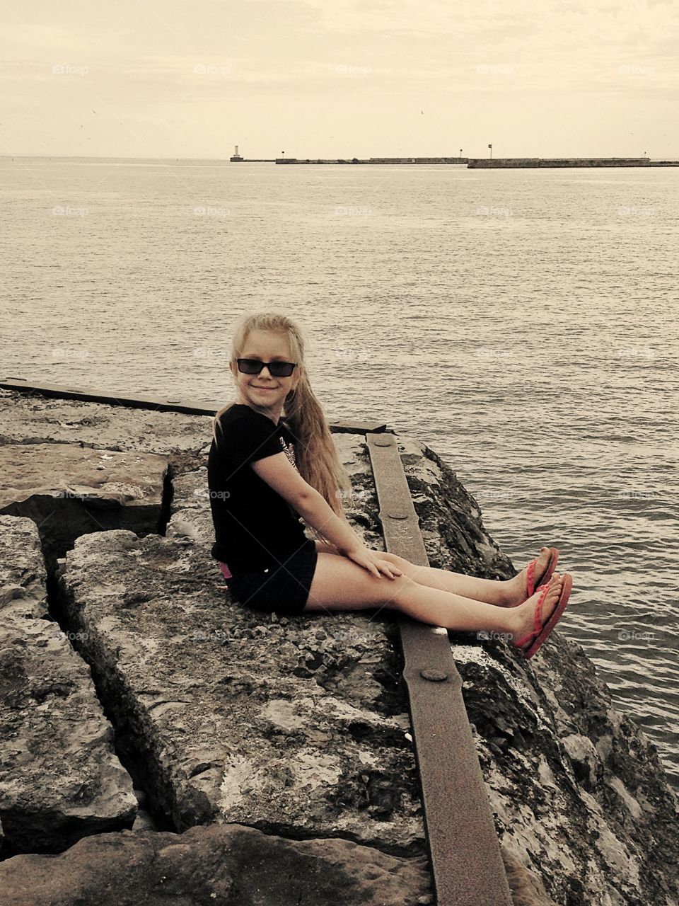 Little girl on Lake Erie. My daughter hanging out next to Lake Erie. 