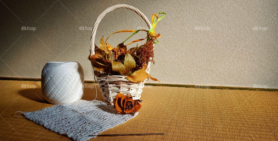 crochet work next to dried flower
