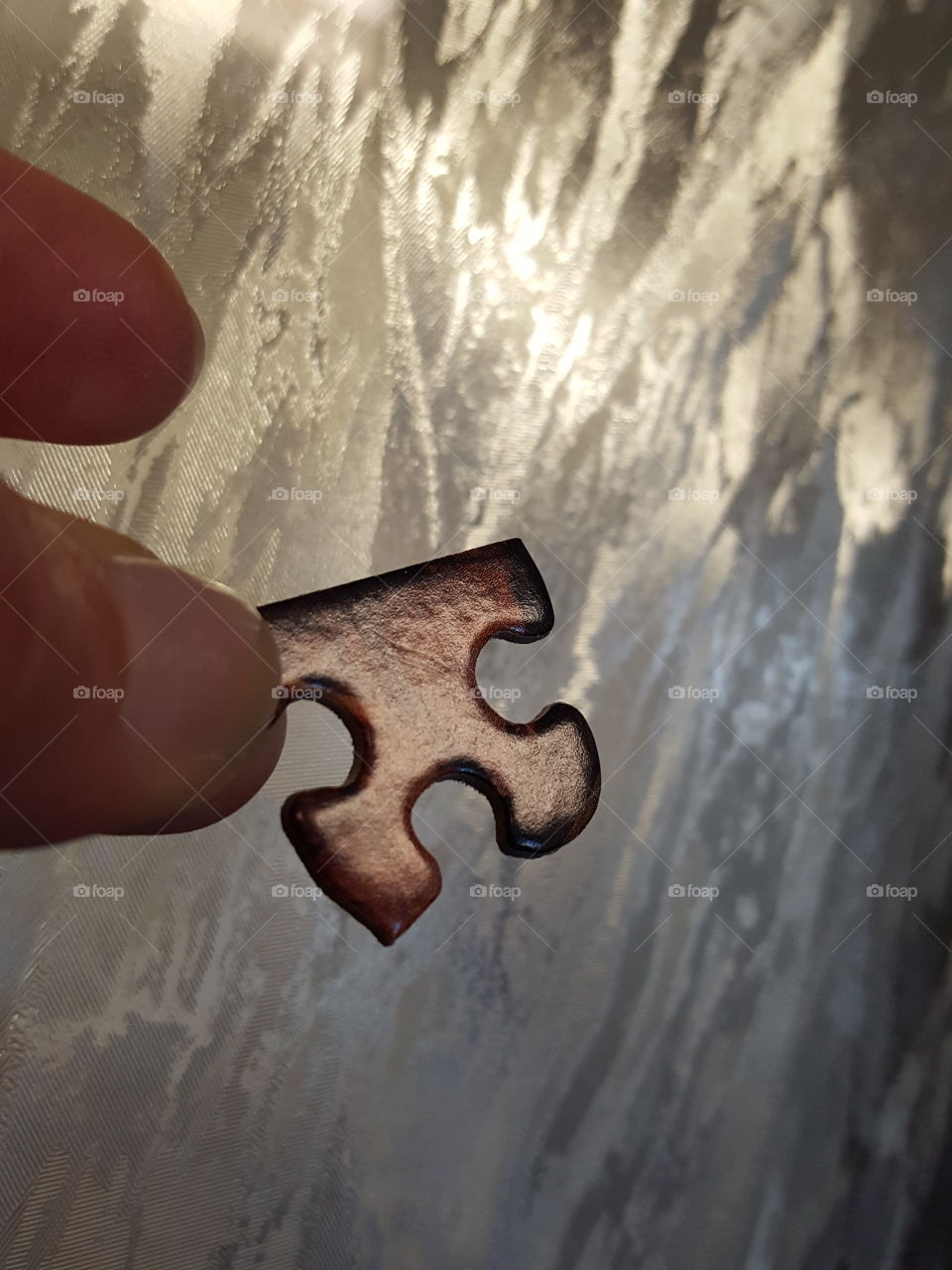 Man holding puzzle piece