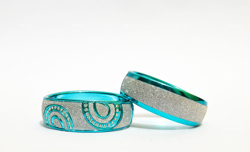 fashipn jewellery photo shoot. elegant glittering bangles with aqua blue color.
