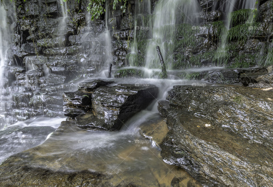 Rugged rock wall waterfall