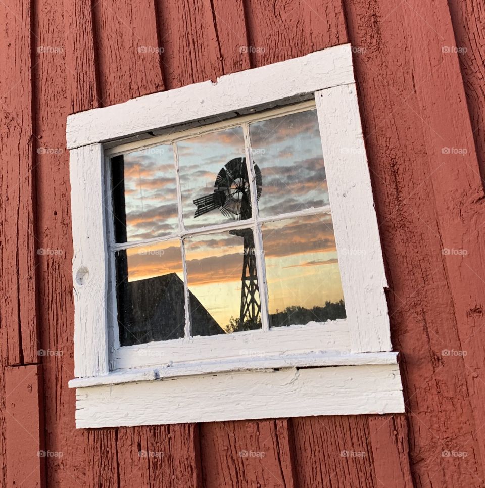 Windmill sunset reflection