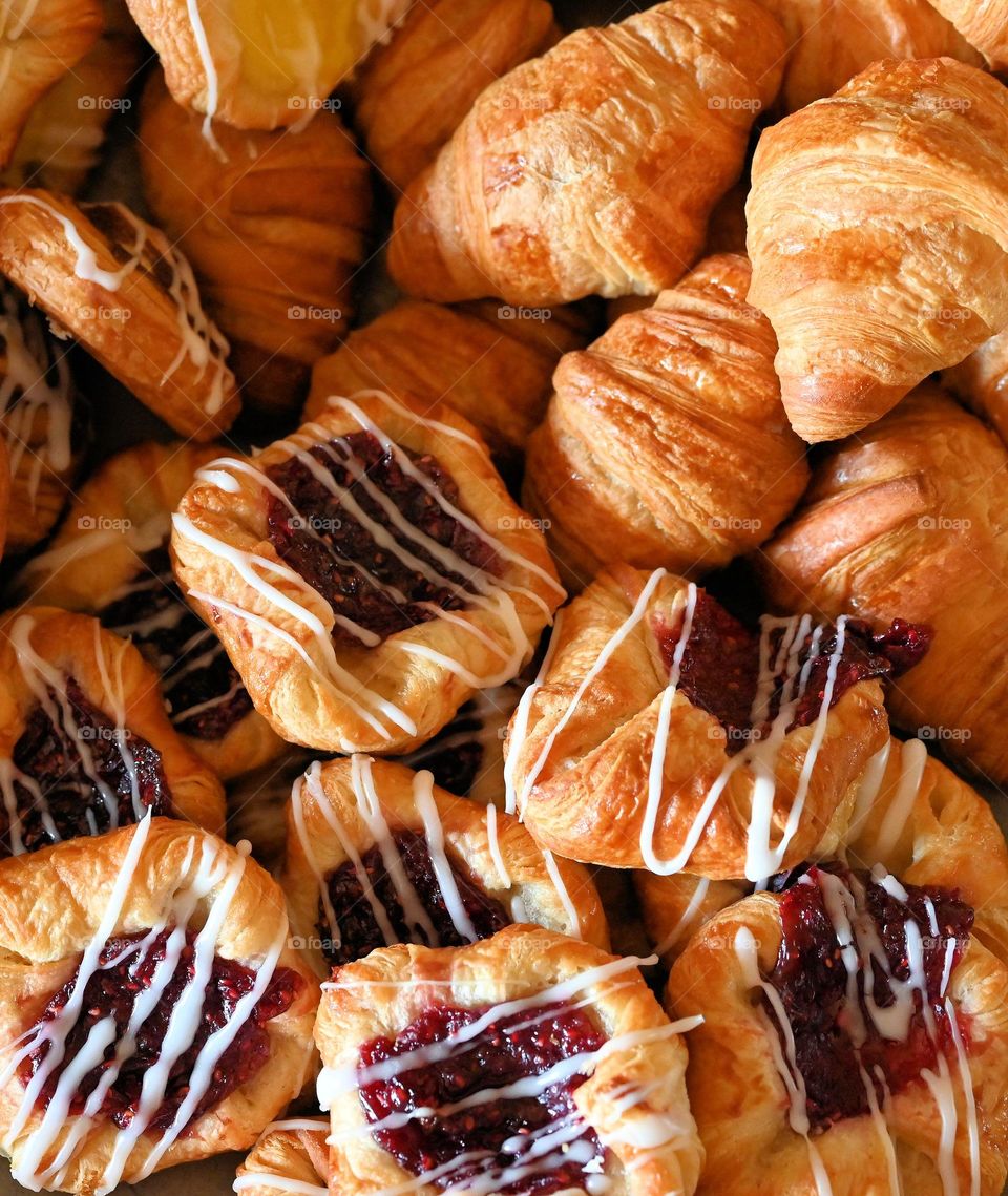 Close up shot of different flavors and shapes of croissants freshly baked and serve for the season. 
