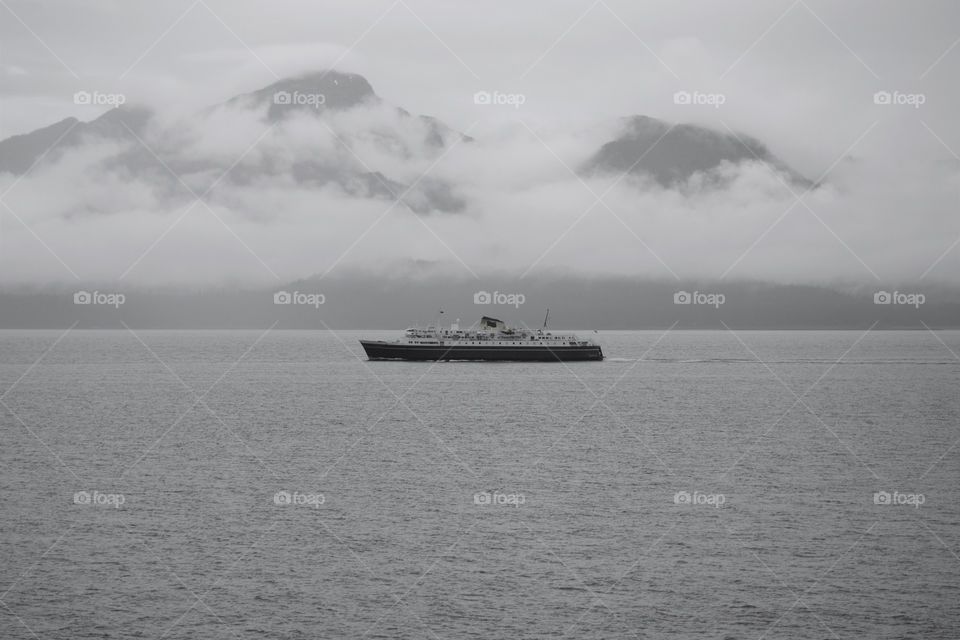 A large passenger ferry makes its way through a Alaskan sound